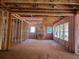 Spacious interior with exposed framing, wiring, and insulation, ready to be transformed into a comfortable living area at 2759 S Waterworks Rd, Buford, GA 30518