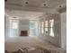 An unfinished Living Room with many windows to allow a lot of natural light at 2759 S Waterworks Rd, Buford, GA 30518