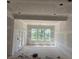 Unfinished living room featuring a large window set and great natural light at 2759 S Waterworks Rd, Buford, GA 30518