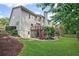 Well-maintained backyard with lush lawn, wooden deck, and privacy fence at 640 Windwalk Dr, Roswell, GA 30076