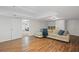 Finished basement with laminate flooring and a comfortable seating area at 640 Windwalk Dr, Roswell, GA 30076