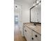 Well-maintained bathroom features a granite countertop, a sink with a black faucet, and tile flooring at 640 Windwalk Dr, Roswell, GA 30076