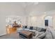 Spacious open-concept living room featuring neutral color palette and an archway to the kitchen, with lots of light at 640 Windwalk Dr, Roswell, GA 30076