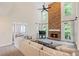 Bright open concept living room featuring a stone fireplace and high ceilings with large picture windows at 640 Windwalk Dr, Roswell, GA 30076