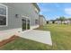 Home featuring a patio with sliding glass door, green lawn and gray siding at 2645 Mourning Dove Drive (Lot 49), Grayson, GA 30017