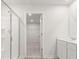Bathroom featuring a glass shower, white vanity, and walk-in closet at 2645 Mourning Dove Drive (Lot 49), Grayson, GA 30017