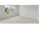 Spacious bedroom with plush carpet, natural light, and neutral paint at 2645 Mourning Dove Drive (Lot 49), Grayson, GA 30017