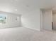 Spacious bedroom featuring soft carpeting and natural light from the windows at 2645 Mourning Dove Drive (Lot 49), Grayson, GA 30017