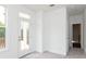 Cozy bedroom with soft carpet, white walls, and a balcony door allowing for plenty of light at 348 Olmstead Way # 30, Alpharetta, GA 30022