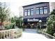 Exterior of Kona Grill, surrounded by decorative plants, providing an upscale and inviting dining atmosphere at 348 Olmstead Way # 30, Alpharetta, GA 30022
