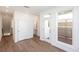 Well-lit living room boasting hardwood floors, white trim, and access to the outdoor patio at 348 Olmstead Way # 30, Alpharetta, GA 30022