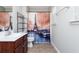 Cozy bathroom featuring vanity, toilet, shelving, and shower tub with Eiffel Tower curtain at 442 Colonial Walk, Woodstock, GA 30189