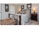 Comfortable bedroom features neutral walls, carpet, upholstered bench, with traditional furniture and decor at 442 Colonial Walk, Woodstock, GA 30189