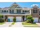 Inviting townhouse with a well-manicured lawn, attached garages and front porch at 442 Colonial Walk, Woodstock, GA 30189