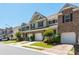 Attractive townhouses with garages and well-maintained lawns at 442 Colonial Walk, Woodstock, GA 30189