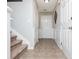 Entrance foyer with tile flooring and stairs leading to the upper level at 442 Colonial Walk, Woodstock, GA 30189