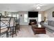 Inviting living room featuring a fireplace and view of the bar seating area at 442 Colonial Walk, Woodstock, GA 30189