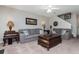 Cozy living room featuring plush sofas, stylish decor, and neutral walls at 442 Colonial Walk, Woodstock, GA 30189