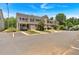 Street view of attractive townhomes with attached garages and manicured landscaping, offering modern living at 442 Colonial Walk, Woodstock, GA 30189