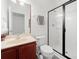 Bathroom with a sleek glass-enclosed shower, modern fixtures, vanity with sink, and coordinated towel accents at 6018 Oakdale Se Rd, Mableton, GA 30126