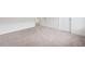 Spacious bedroom featuring neutral carpeting, white walls, and natural light at 6018 Oakdale Se Rd, Mableton, GA 30126