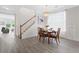 Bright dining room featuring a chandelier and hardwood floors at 6018 Oakdale Se Rd, Mableton, GA 30126