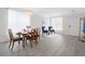 Bright living and dining area with hardwood floors, dining table, and accent chairs at 6018 Oakdale Se Rd, Mableton, GA 30126