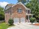 Charming two-story brick home with a two-car garage and manicured front yard at 6018 Oakdale Se Rd, Mableton, GA 30126