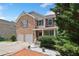 Lovely two-story brick home with a two-car garage, landscaped yard, and curb appeal at 6018 Oakdale Se Rd, Mableton, GA 30126