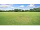 Open field with green grass, perfect for outdoor activities and recreation at 6018 Oakdale Se Rd, Mableton, GA 30126
