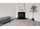 Living room featuring hardwood floors and a fireplace at 6018 Oakdale Se Rd, Mableton, GA 30126