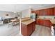 Open-concept kitchen with granite counters, breakfast bar, and stainless steel appliances at 6018 Oakdale Se Rd, Mableton, GA 30126