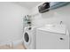 Practical laundry room with white washer and dryer units at 6018 Oakdale Se Rd, Mableton, GA 30126