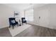 Cozy living room showcasing neutral walls, hardwood floors, and accent chairs at 6018 Oakdale Se Rd, Mableton, GA 30126