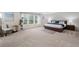 Spacious main bedroom boasts an oversized window, plush carpet, and modern accents for a serene retreat at 6018 Oakdale Se Rd, Mableton, GA 30126