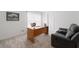 Cozy office space with a desk, recliner, and natural light at 6018 Oakdale Se Rd, Mableton, GA 30126