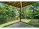 Covered patio area overlooks the backyard, offering shade and relaxation at 6018 Oakdale Se Rd, Mableton, GA 30126