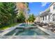 Beautiful pool and jacuzzi area with surrounding green trees and lush vegetation at 65 Gatewood Dr, Marietta, GA 30068