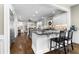 Open kitchen with stainless appliances, granite countertops, and breakfast bar seating at 65 Gatewood Dr, Marietta, GA 30068