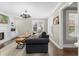 Well-lit living room with fireplace, built-in shelves, and plantation shutters at 65 Gatewood Dr, Marietta, GA 30068