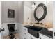 Classic powder room featuring black toilet, sink and mirror at 65 Gatewood Dr, Marietta, GA 30068