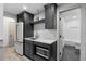 Contemporary wet bar featuring modern appliances, white subway tile, and a view into the bathroom at 65 Gatewood Dr, Marietta, GA 30068