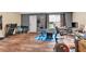 Finished basement with home gym setup, desk area, and wood-look flooring at 218 Depot Ln, Dallas, GA 30157