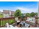 Relaxing deck area with comfortable outdoor seating and railing at 218 Depot Ln, Dallas, GA 30157