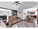 Open-concept living area with hardwood floors, stylish furniture, and seamless flow to the kitchen at 218 Depot Ln, Dallas, GA 30157
