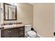 Elegant half bathroom with a dark vanity, granite countertop and a toilet at 218 Depot Ln, Dallas, GA 30157