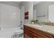Bathroom featuring a granite countertop, white subway tile, and a shower-tub combination at 2817 Lincoln Dr, Decatur, GA 30033