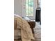 Closeup on a corner of the bedroom: end of the bed, rug, decor and deck doorway at 2817 Lincoln Dr, Decatur, GA 30033
