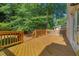 A wooden deck is a tranquil outdoor space with views of the lush trees in the backyard at 2817 Lincoln Dr, Decatur, GA 30033