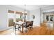 Dining room boasts hardwood floors, a pendant light, large windows, and access to french doors at 2817 Lincoln Dr, Decatur, GA 30033